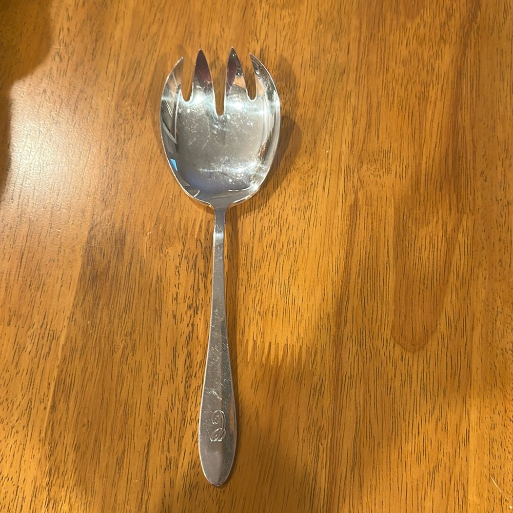 Reed & Barton silver plated forked serving spoon. C is engraved on the handle.